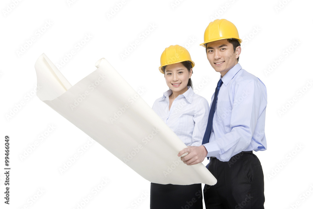 Construction management looking at blueprints Construction management looking at blueprints