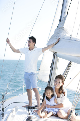 Happy family on a sailboat