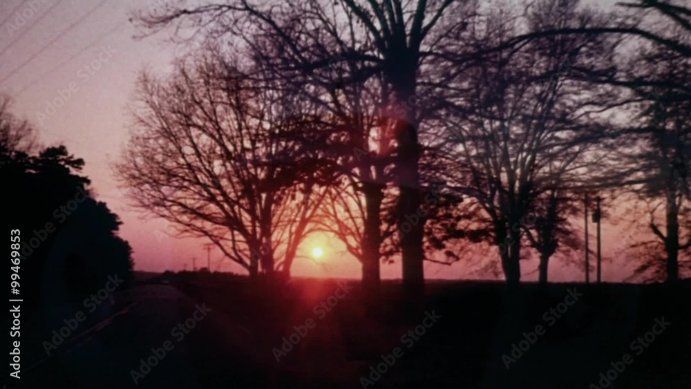 Dissolve shot of Rolls Royce driving through beautiful sunset Dissolve shot of Rolls Royce driving through beautiful sunset