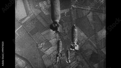 Airplane dropping bombs during World War II photo