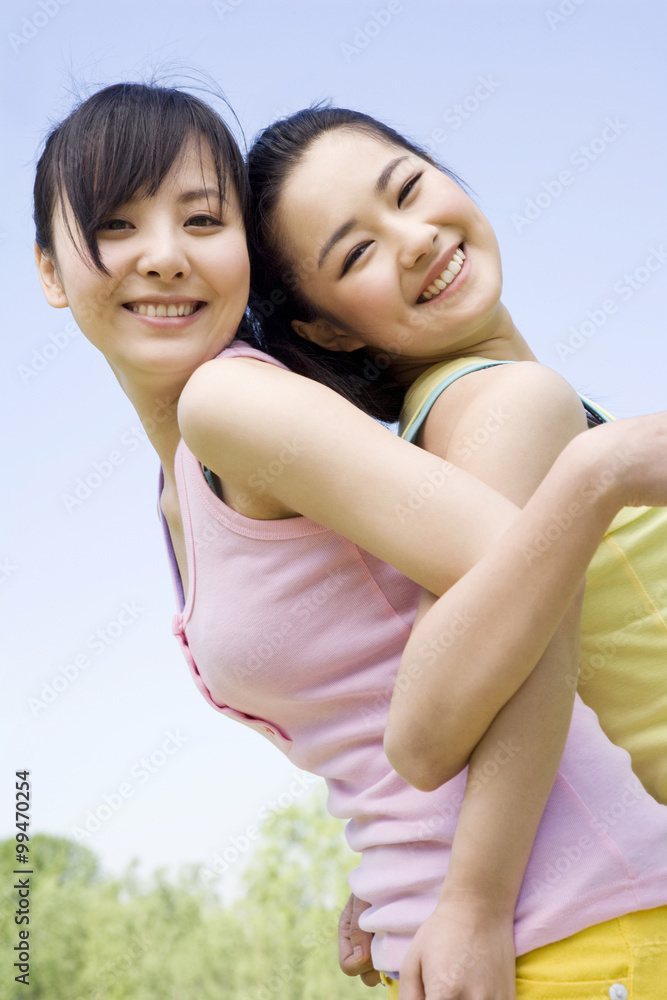 Portrait of two girlfriends at the park Portrait of two girlfriends at the park