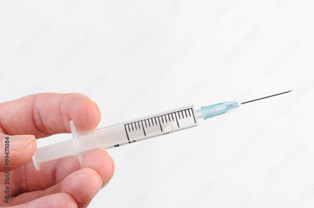 syringe in hand syringe in hand