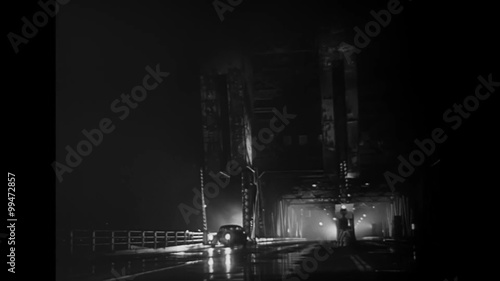 Car stopping on bridge at night, Los Angeles, California, 1940s photo