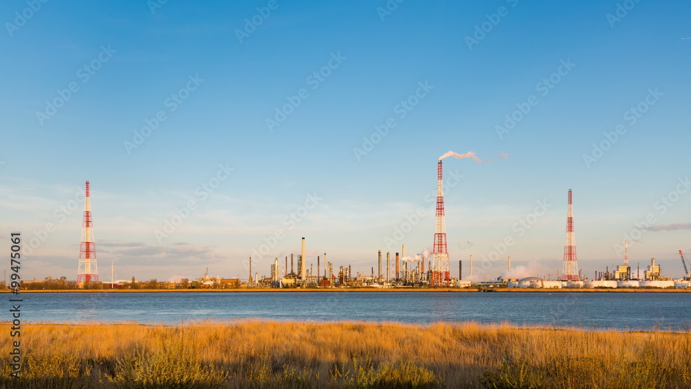 Timelapse sequence of a large oil refinery in the harbor of Antwerp, Belgium with blue sky and warm evening light in 4K. Timelapse sequence of a large oil refinery in the harbor of Antwerp, Belgium with blue sky and warm evening light in 4K.
