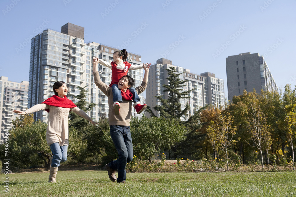 Young Family Enjoying a Park in Autumn
