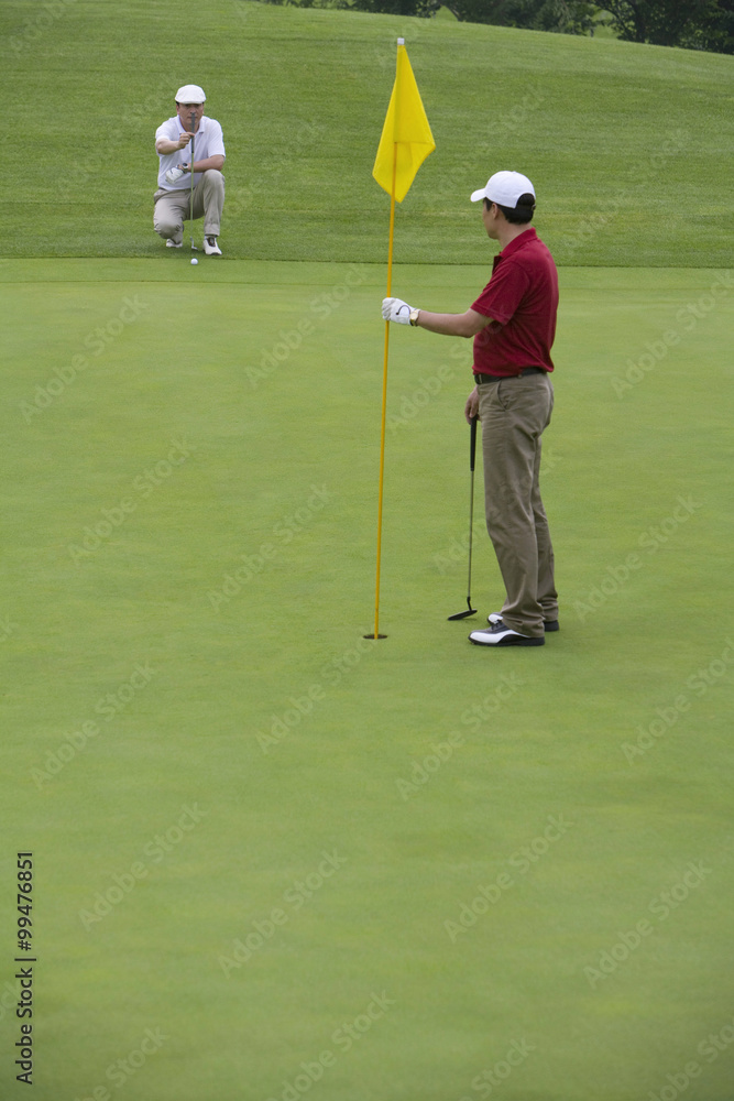 Fototapeta premium Two Golfers on the Green