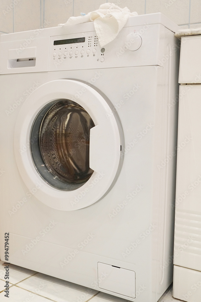 The image of washing machine at the bathroom. The image of washing machine at the bathroom.
