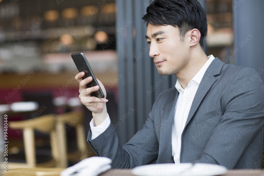 Young man using smart phone Young man using smart phone