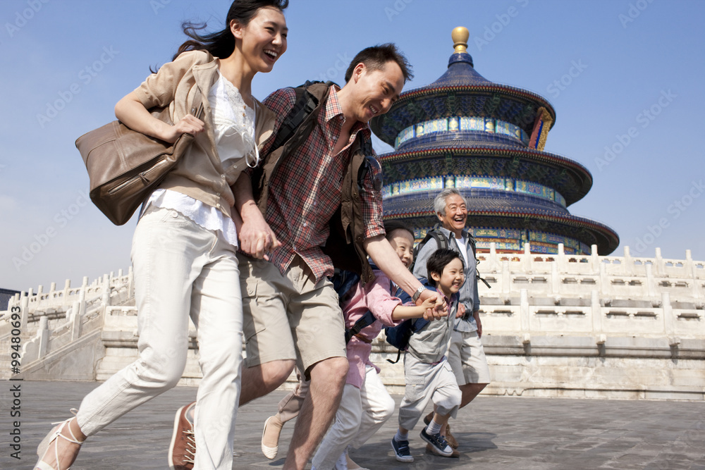 Happy family travelling at Temple of Heaven in Beijing, China