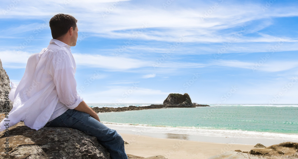 Man Sitting on Rock