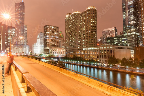Chicago buildings, illuminated towering into dark night sky