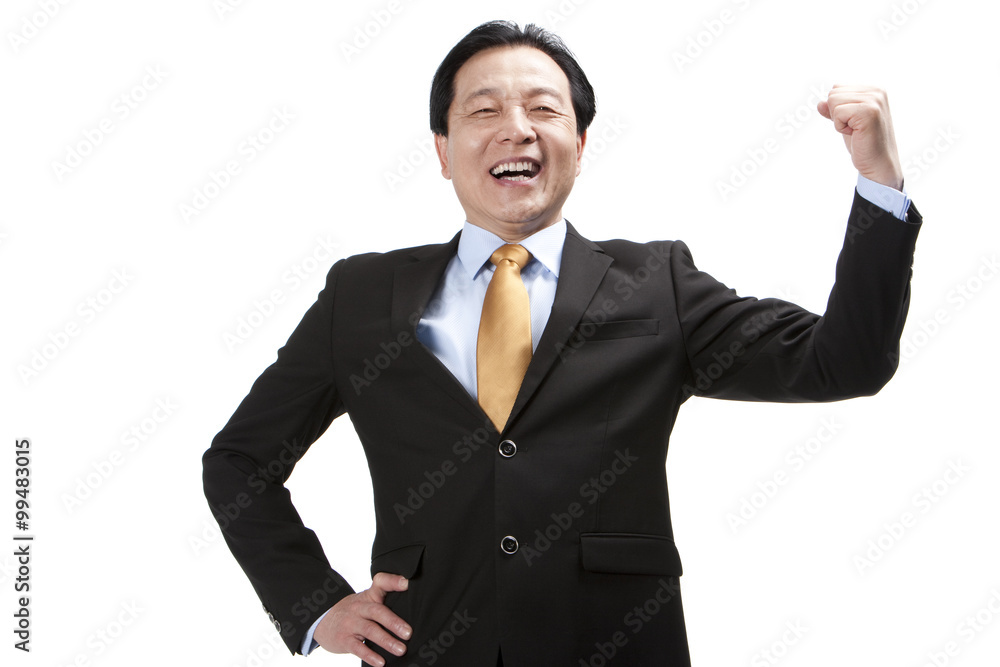 Excited senior businessman punching the air Excited senior businessman punching the air