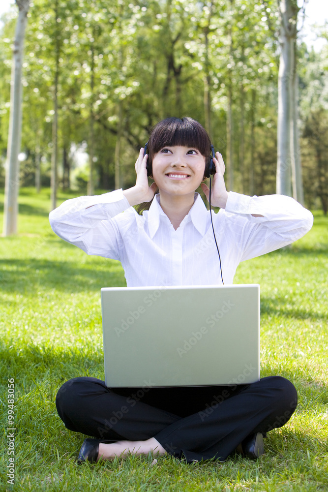 Woman in park with headset Woman in park with headset