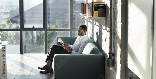 Businessman Reading Magazine Relaxation Concept © Rawpixel.com