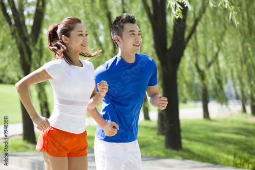 Young couple jogging in park