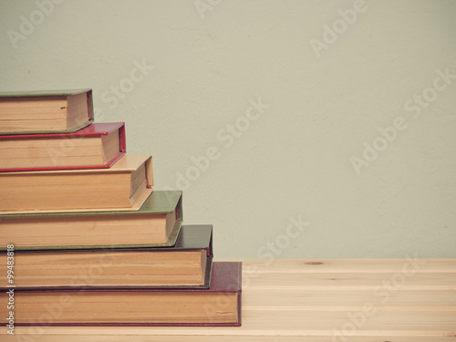 Books on a wooden shelf