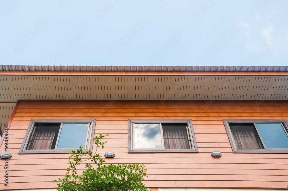 roof on a wood house with blue sky