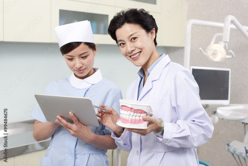 Dentist and nurse in dental clinic Dentist and nurse in dental clinic
