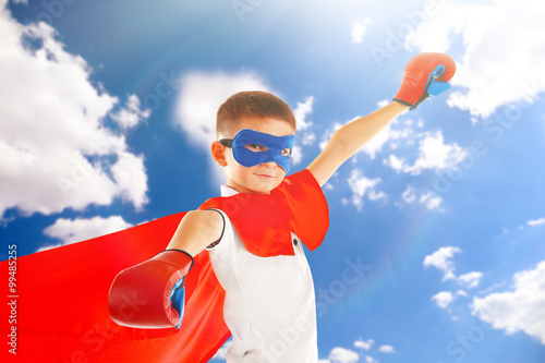 Boy dressed as superhero wi...