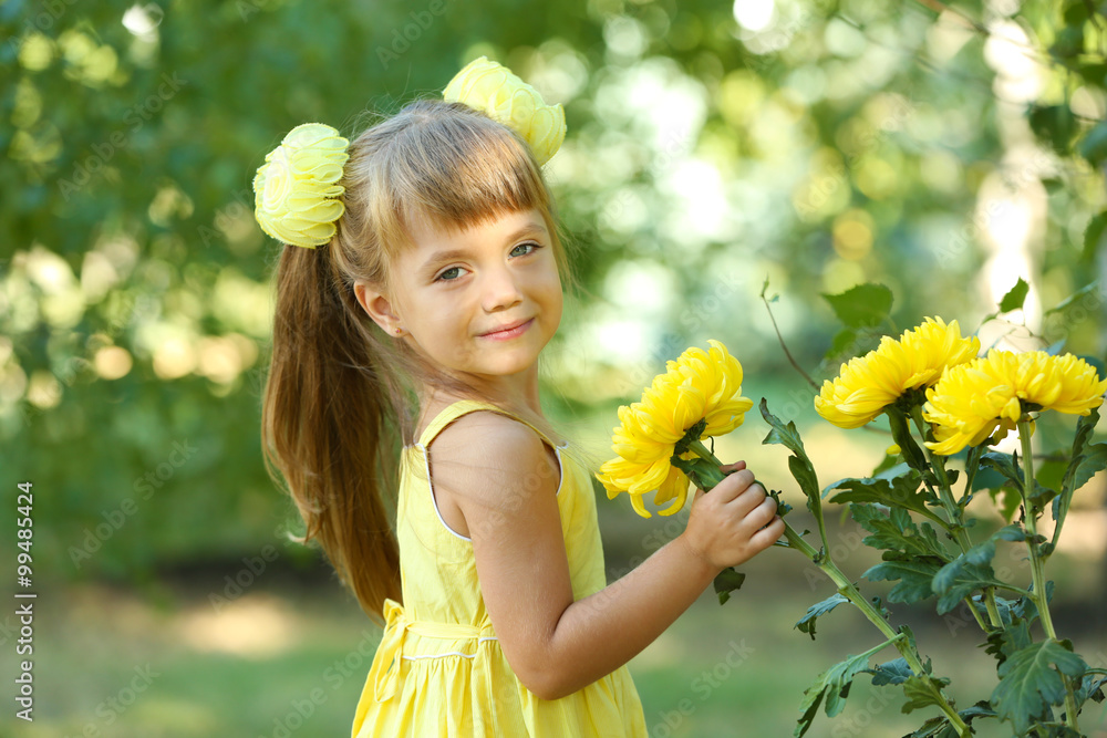 Little girl with flowers outside Little girl with flowers outside