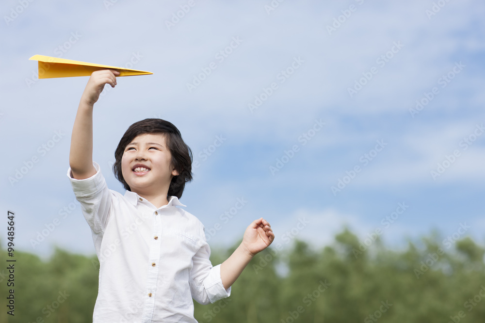 Little boy with paper airplane Little boy with paper airplane