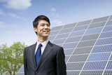 Portrait of a businessman in front of solar panels