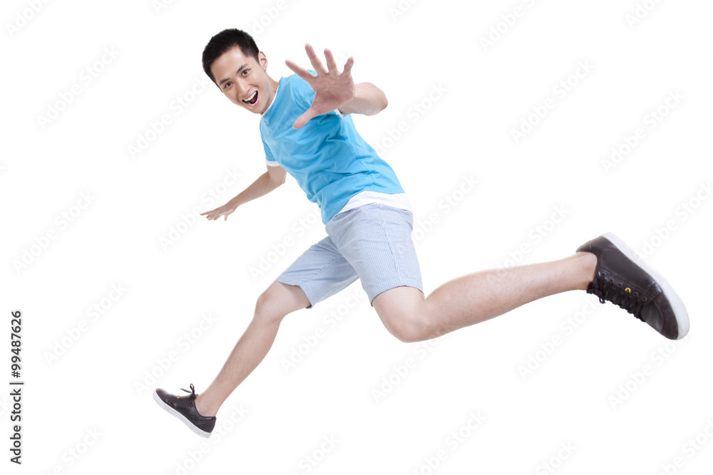 Excited young man running