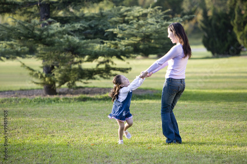 Mother and daughter playing in the park © Blue Jean Images