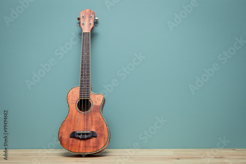 vintage tone of still life with ukulele Old  wall photo