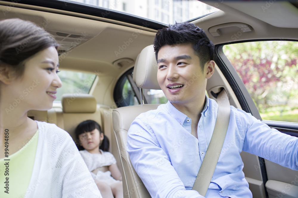 Happy young family in a car Happy young family in a car