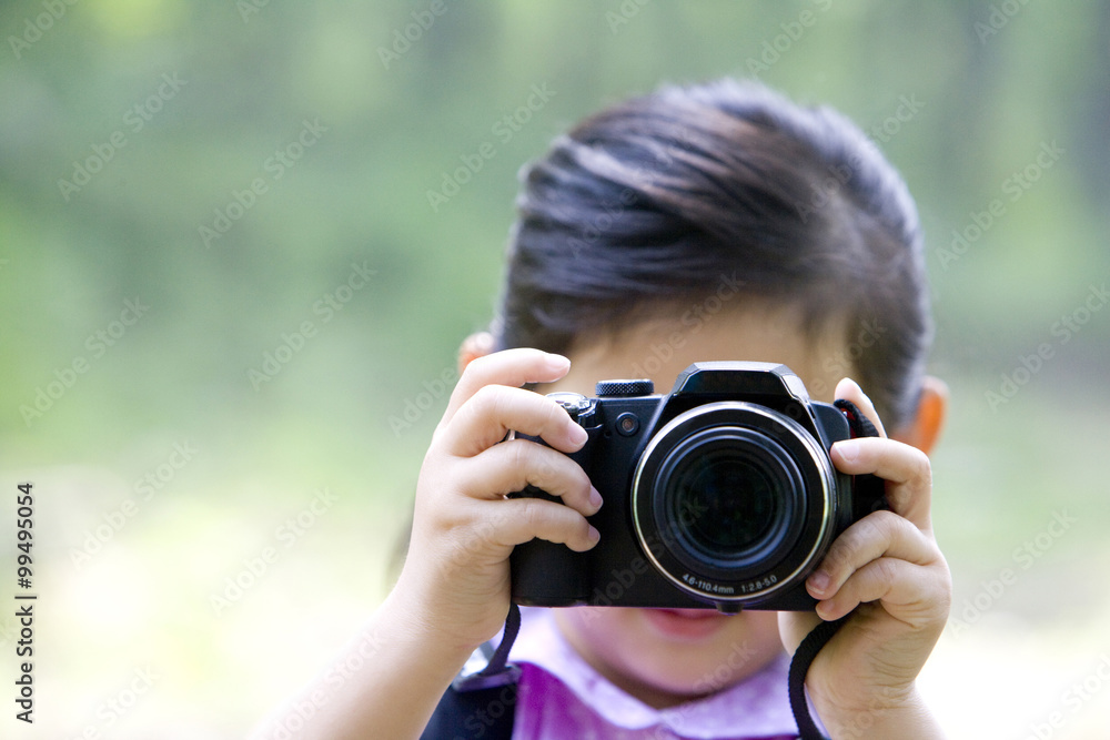 Little girl taking photos in nature Little girl taking photos in nature