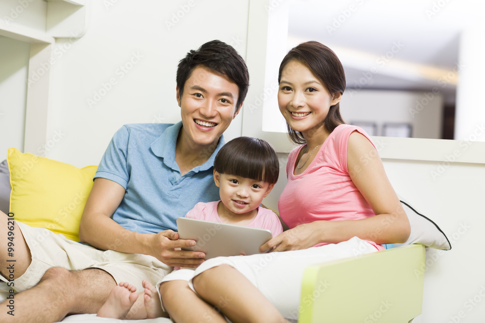 Happy family with digital tablet