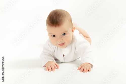 Baby newborn in the shirt closeup on white background.