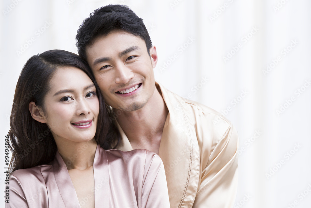 Happy young couple in bedroom Happy young couple in bedroom