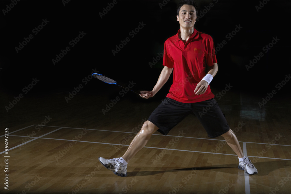 Young Man Playing A Game Of Badminton