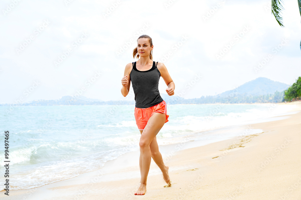 Sports. Fit Female Athlete Jogger Running On Beach. Sporty Athletic Woman Jogging During Workout Outside. Fitness, Exercising, Healthy Lifestyle. Health Concept Sports. Fit Female Athlete Jogger Running On Beach. Sporty Athletic Woman Jogging During Workout Outside. Fitness, Exercising, Healthy Lifestyle. Health Concept