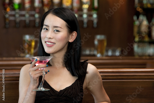 A Woman Relaxing at a Bar