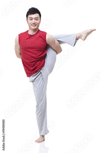 Young man doing yoga © Blue Jean Images
