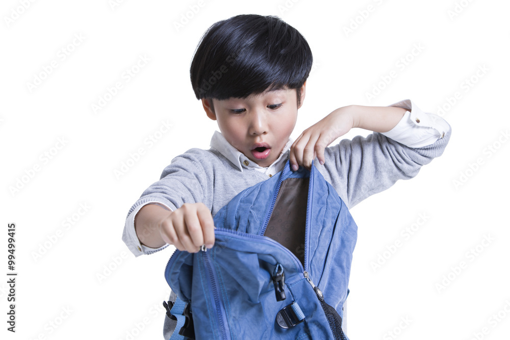 Cute schoolboy opening book bag with surprise Cute schoolboy opening book bag with surprise