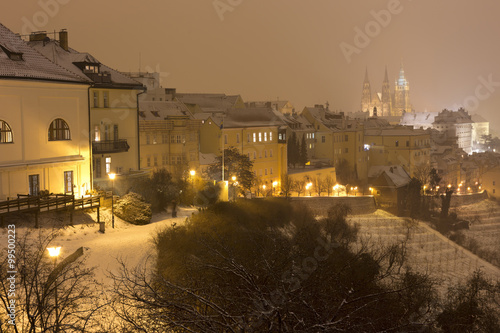 Night foggy snowy Prague City with gothic Castle  Czech republic