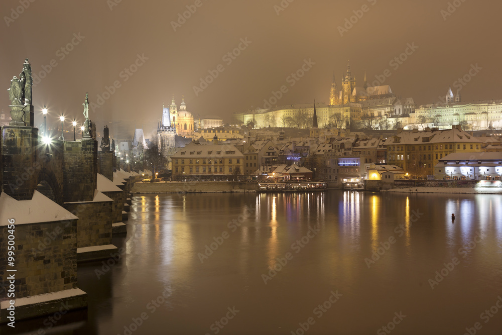 Night Prague gothic Castle and St. Nicholas' Cathedral with Charles Bridge, Czech republic