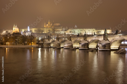 Night Prague gothic Castle and St. Nicholas  Cathedral with Charles Bridge  Czech republic