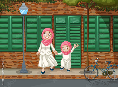 Muslim girls on the sidewalk