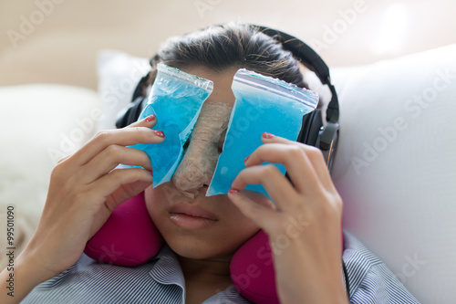 women use cool gel foment on face after rhinoplasty in bedroom