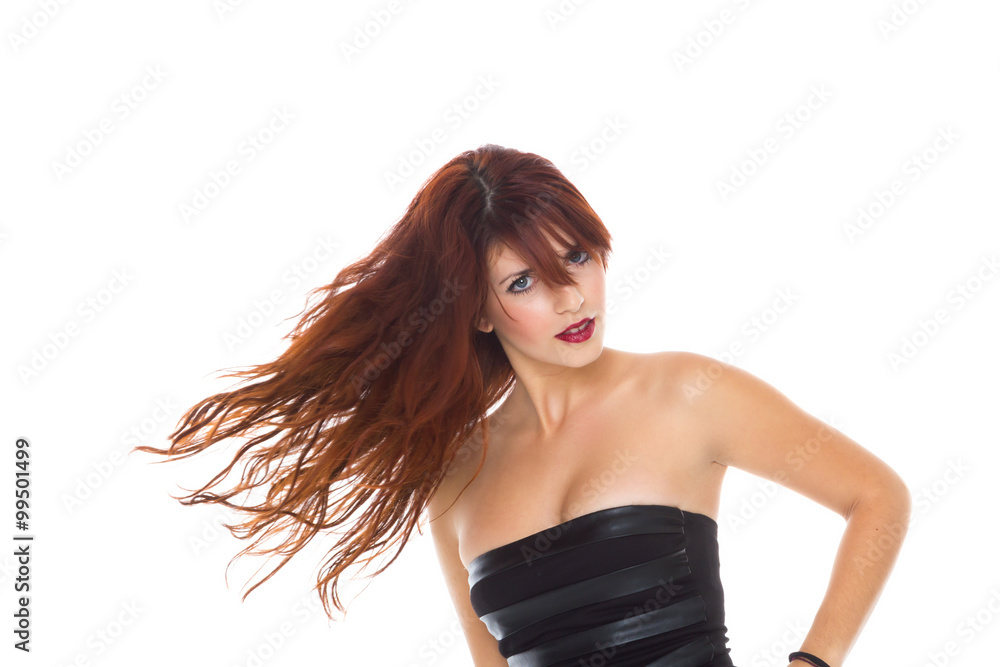 Young woman dancing with her long hair fluttering in motion Young woman dancing with her long hair fluttering in motion