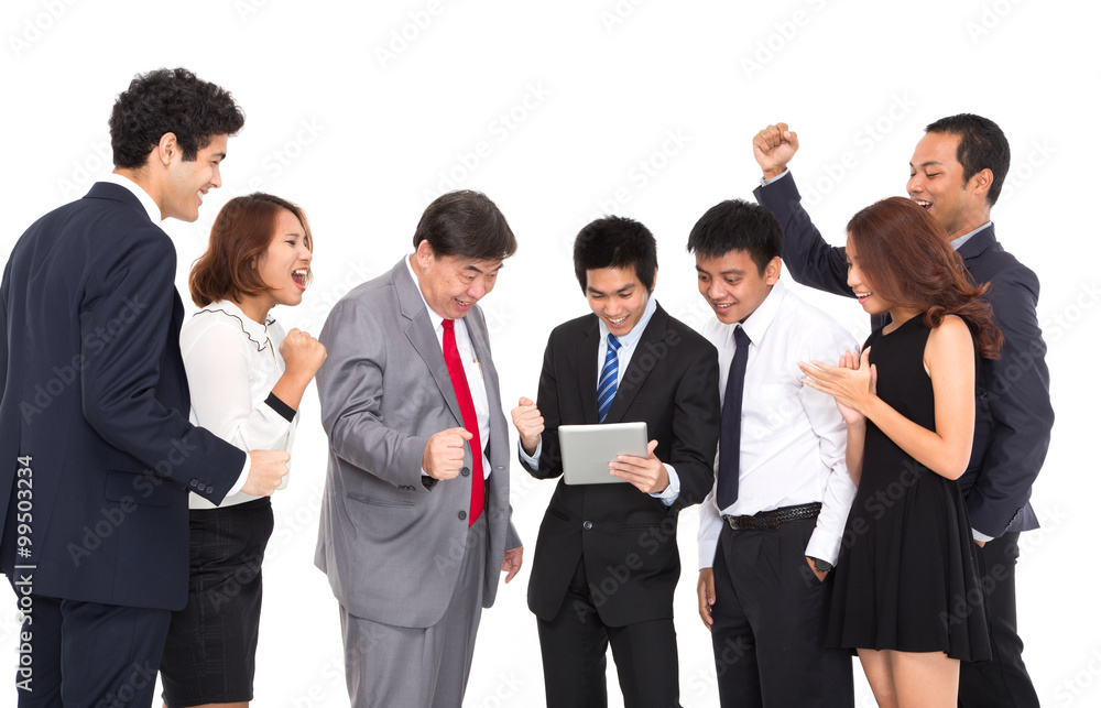 Business people looking at tablet and celebrating Business people looking at tablet and celebrating