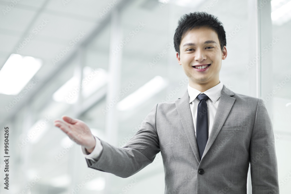 Happy young businessman gesturing Happy young businessman gesturing