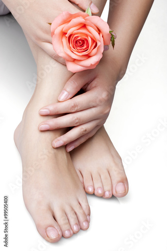Woman Holding Rose and Touching Feet