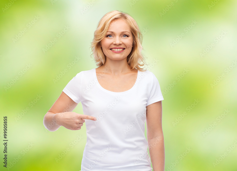 smiling woman in white t-shirt pointing to herself smiling woman in white t-shirt pointing to herself