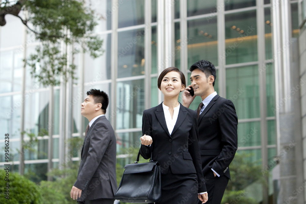 Cheerful office workers on the move outdoors, Hong Kong Cheerful office workers on the move outdoors, Hong Kong